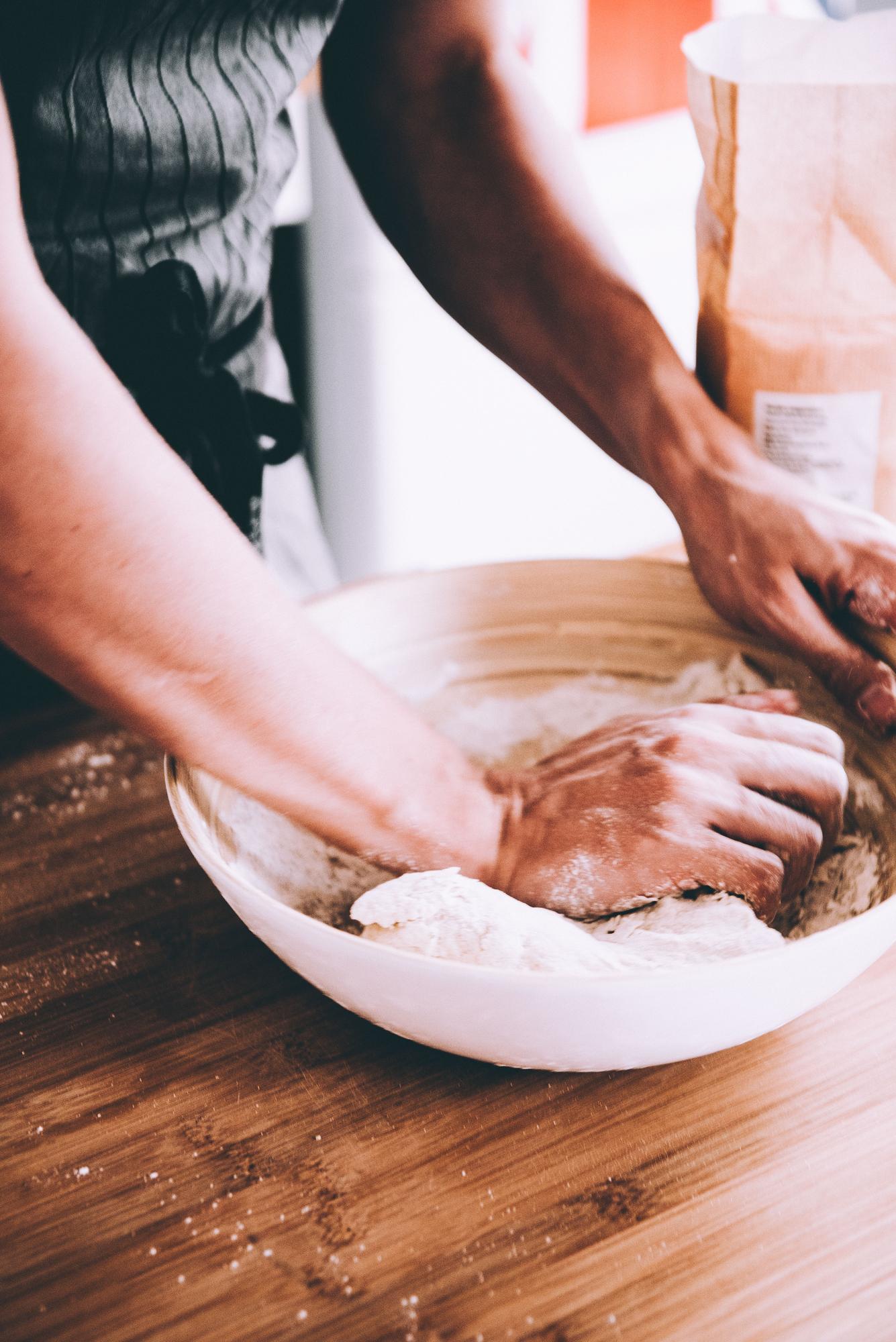Close-up: hands folding pastry dough